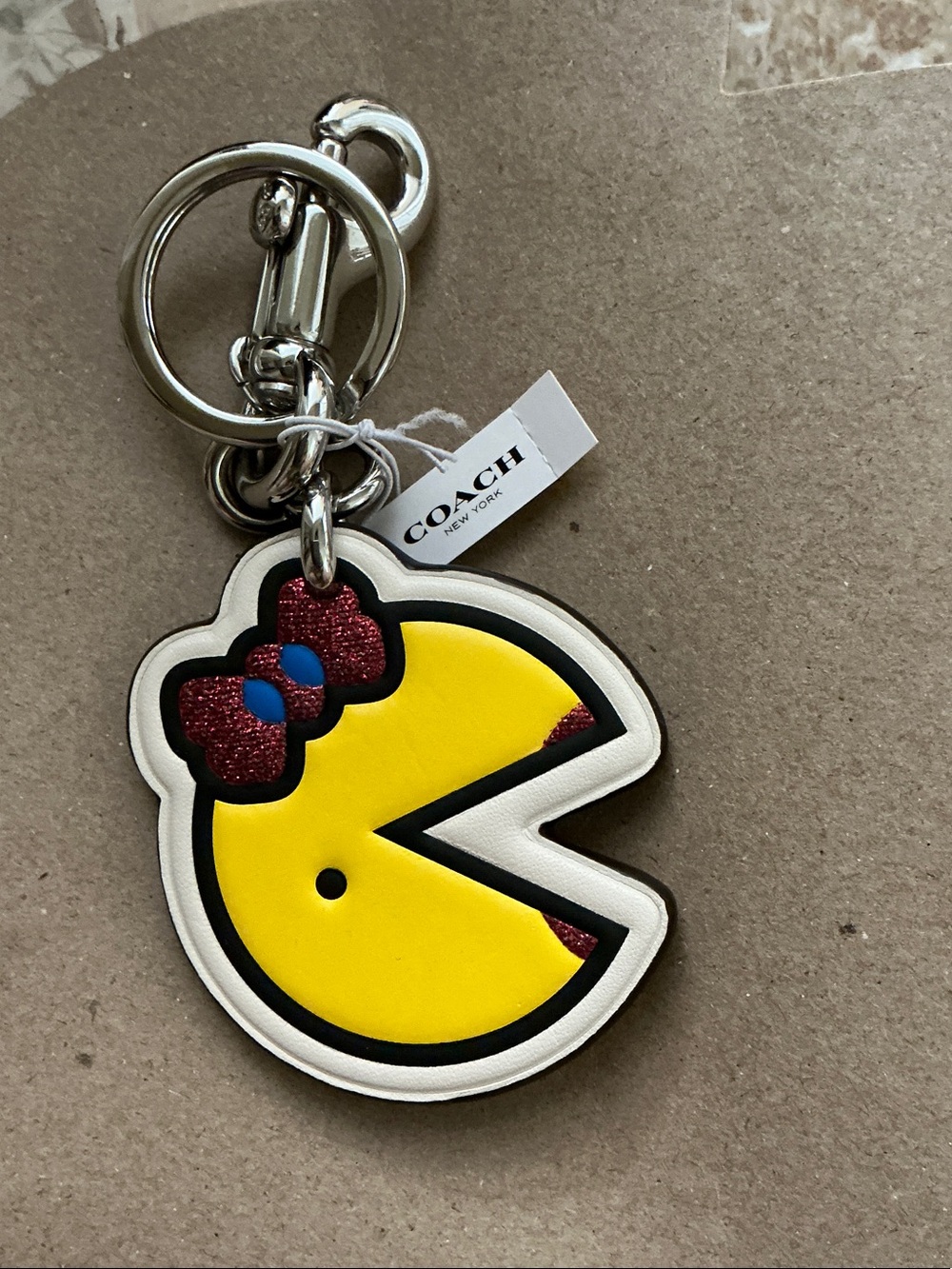 Coach Limited Edition Mrs. Pacman bag charm. Leather material, new with tag.